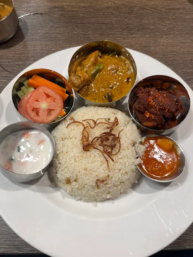 Kerala Thali - South Indian meals platter with rice, curries and roast at Kerala Restaurant Edmonton